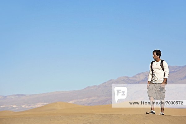 Young Man Hiking in Desert
