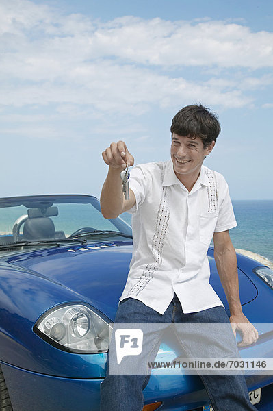 Mid-Adult Man Holding Car Keys