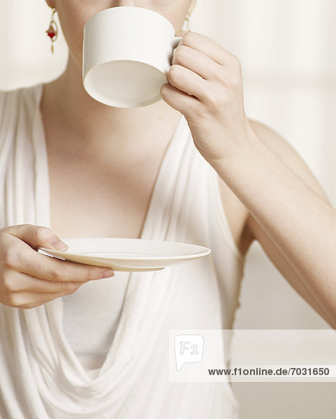 Close-Up of Young Woman Drinking Tea