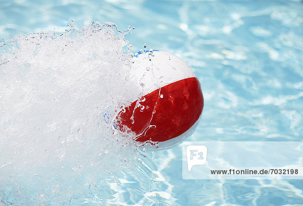 Beach Ball Splashing Water