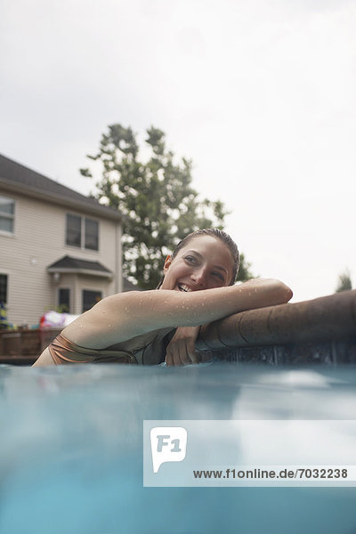 Mid-Adult Woman Resting in Swimming Pool
