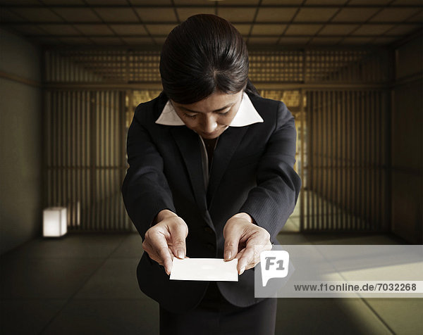 Businesswoman Giving Business Card
