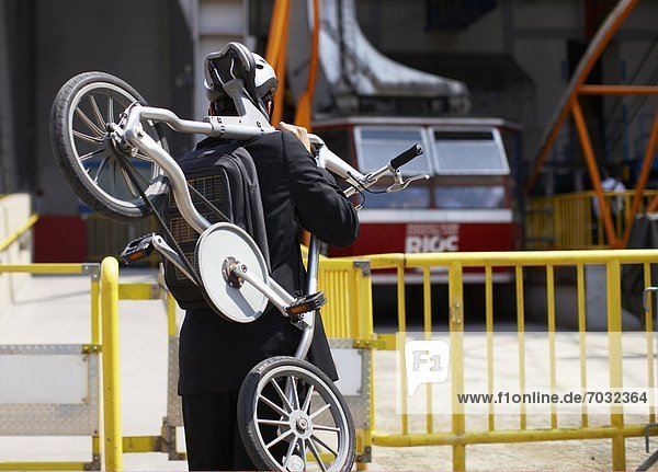 Businessman Carrying Bicycle to Roosevelt Island Tramway