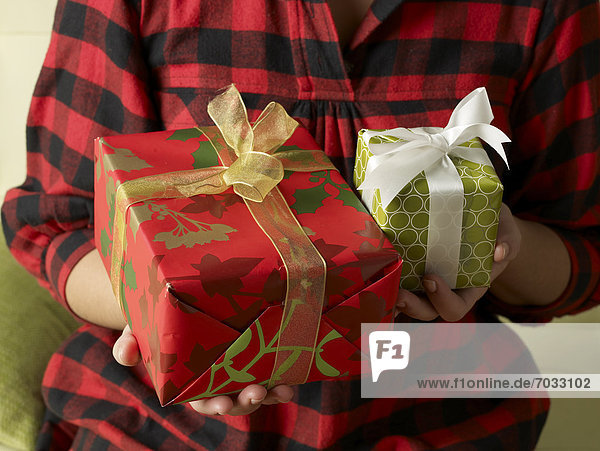 Woman Holding Two Christmas Presents