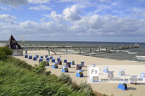 Beach chairs and pier on the beach of Koserow  Usedom  Germany