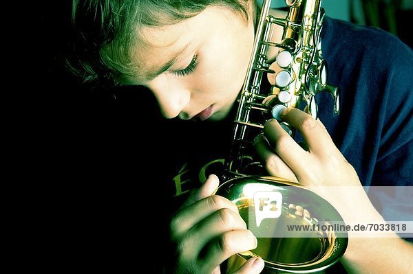 Young Boy Playing Saxophone