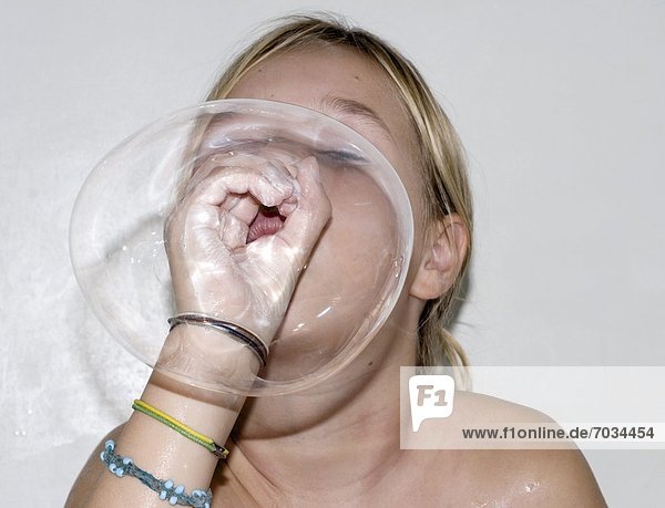 Young Girl Blowing Bubble