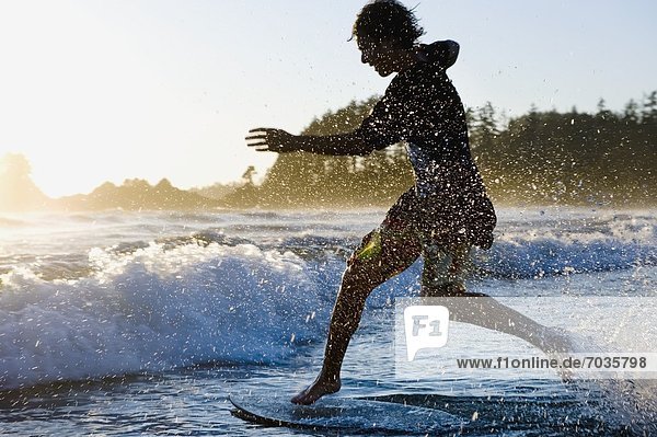 Person Skimboarding