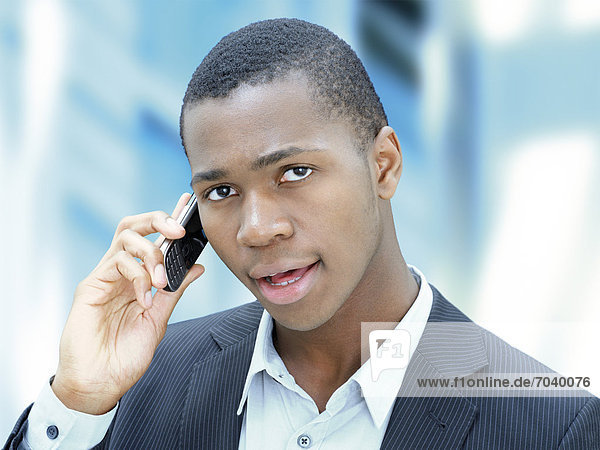 Young businessman  African-American  American  speaking on his mobile phone  respectable  competent