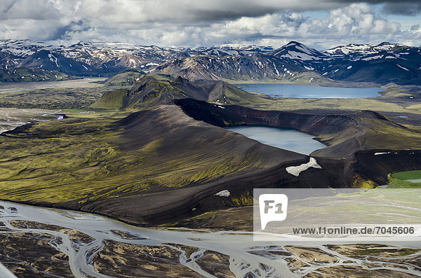 Aerial view  LjÛtipollur Crater Lake  rhyolite mountains partially covered with snow  Tungna· braided river  Landmannalaugar  Fjallabak conservation area  Icelandic Highlands  Iceland  Europe