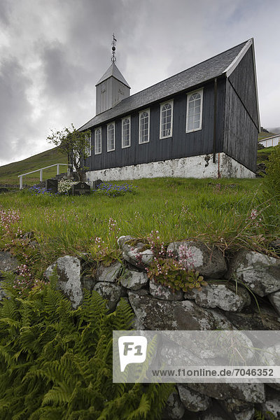 Small cemetery  wooden church in the community of Bour on V·gar Island  Faroe Islands  North Sea  Northern Europe  Europe