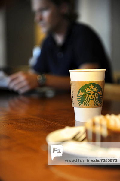 Starbucks coffee mug with a cinnamon bun
