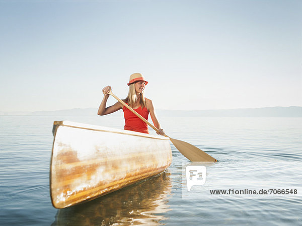Portrait of young woman canoe traveling