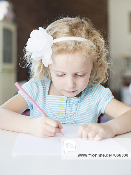 Girl drawing with colour pencil