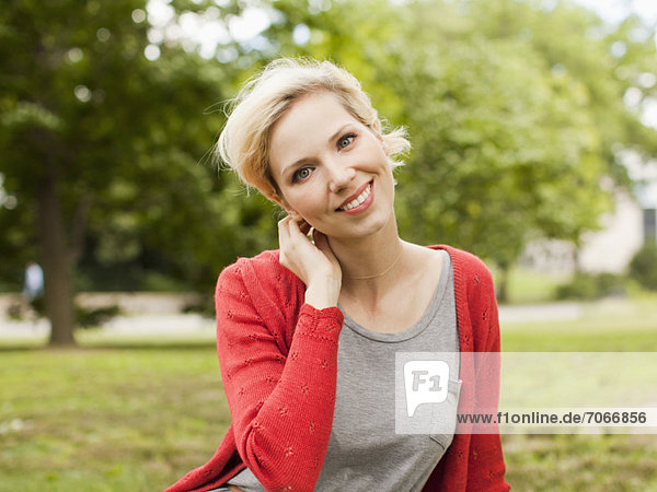 Portrait of smiling woman in park