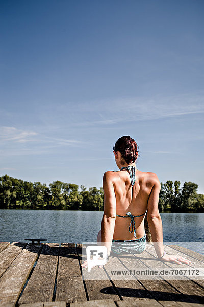 Young woman at lakeside
