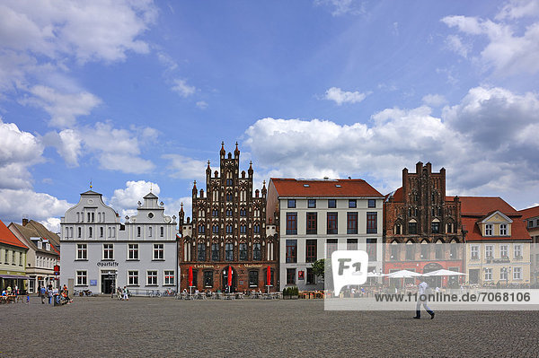 Historic gabled houses on Markt square  the second house from the left is a town house with a stepped gable  brick architecture around 1400  Markt square 11  further right a Gothic-style gabled house  Markt square 13  Greifswald  Mecklenburg-Western Pomerania  Germany  Europe