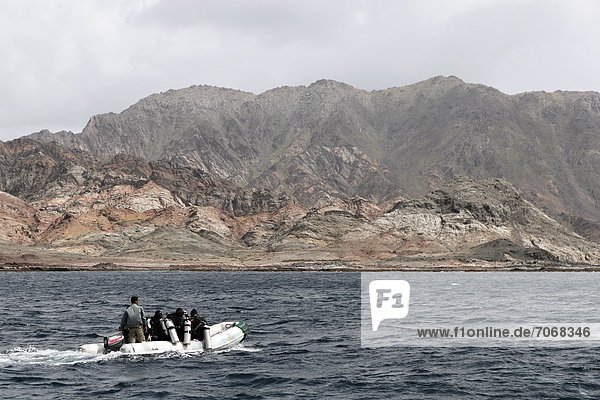 Divers on a boat  Khuriya Muriya Islands  Oman  Indian Ocean