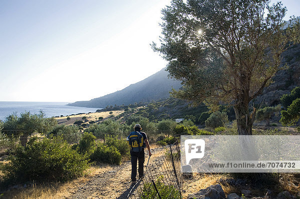 Man hiking on coastal landscape  Crete  Greece
