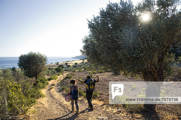 Couple hiking on coastal landscape  Crete  Greece
