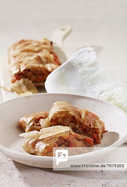Herb strudel filled with meat and vegetables