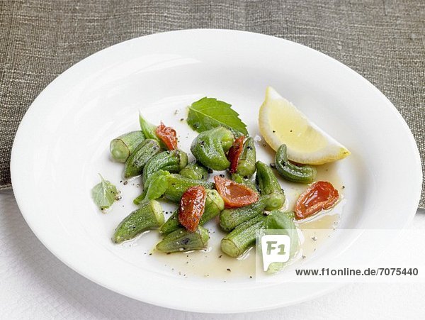 An okra medley with cherry tomatoes