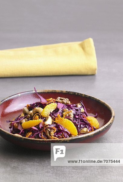 Red cabbage salad with oranges  walnuts and cashew nuts