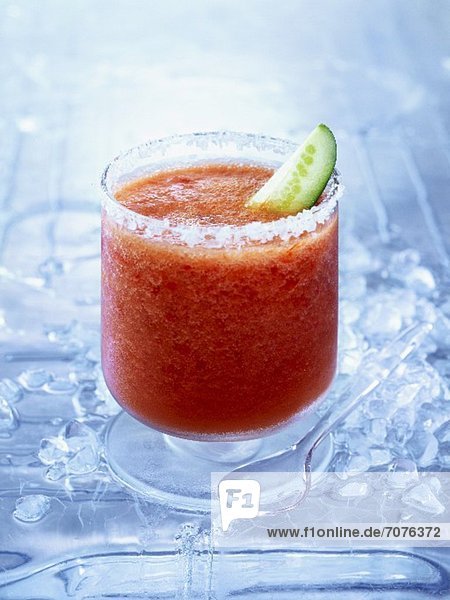 Frozen Bloody Mary with a slice of cucumber