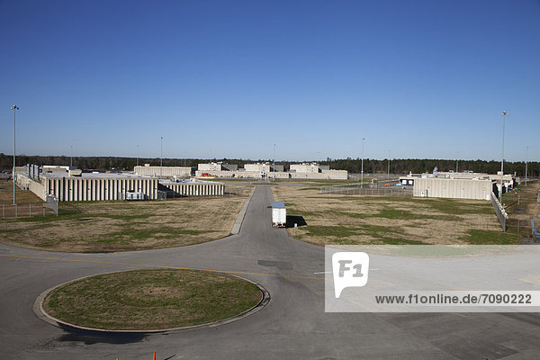 Elevated view of Prison grounds  buildings  and perimeter fencing at a Correctional Facility.