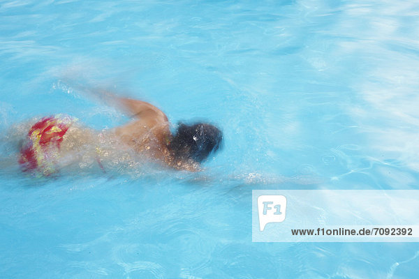 Germany  Mature woman swimming in pool