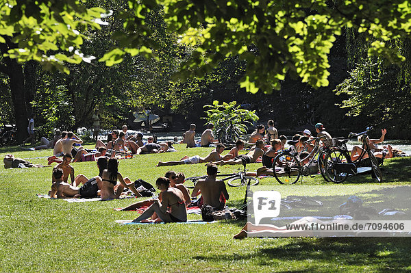 People basking in the English Garden  Munich  Bavaria  Germany  Europe