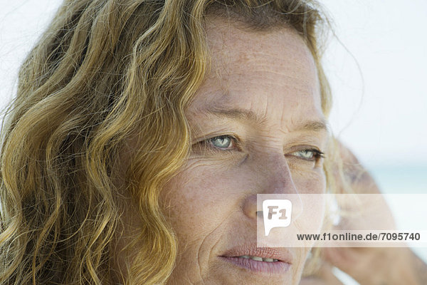 Mature woman daydreaming  portrait