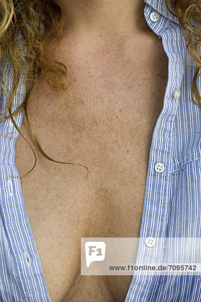Close-up of mature woman's chest and cleavage
