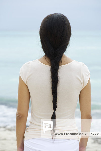 Woman with long braid  rear view