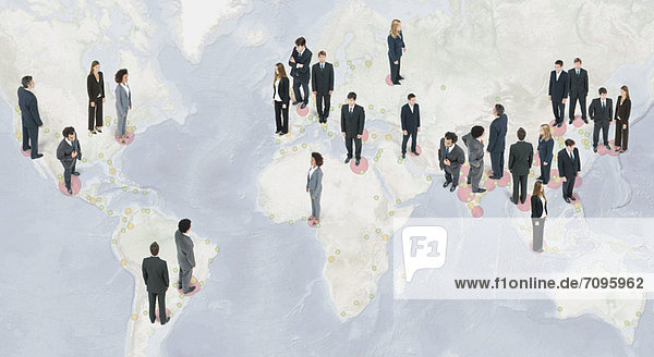 Large group of business people standing on world map