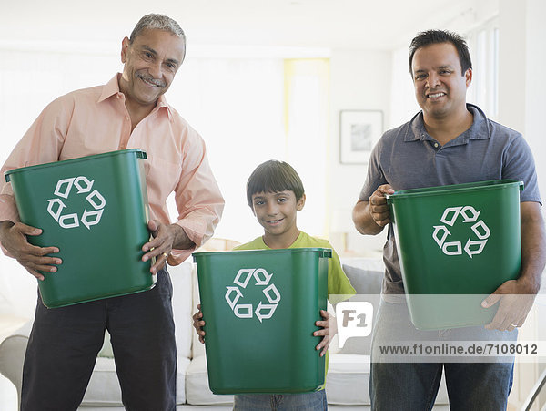Hispanic grandfather  father and son recycling