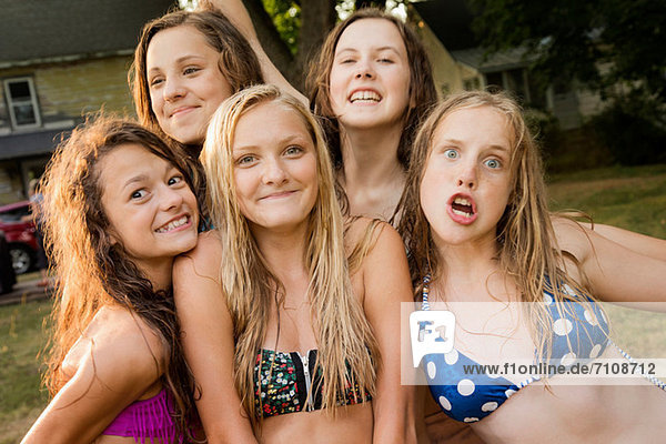 Portrait of five girls wearing bikini tops