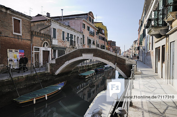 Boats in Rio de Sant'Ana  bridge  houses along a canal  Castello  Venice  Venezia  Veneto  Italy  Europe