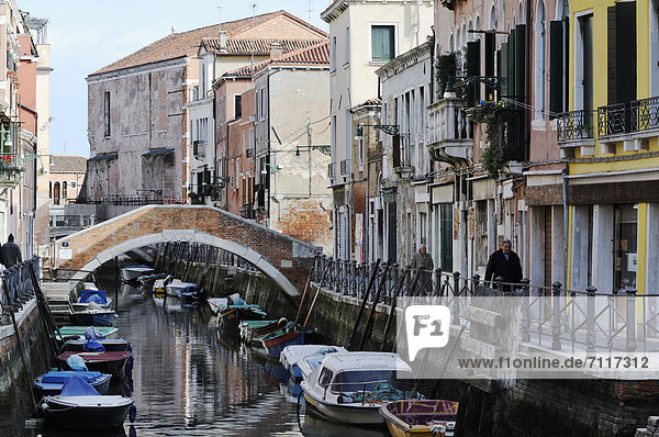 Boats in Rio de Sant'Ana  bridge  houses along a canal  Castello  Venice  Venezia  Veneto  Italy  Europe