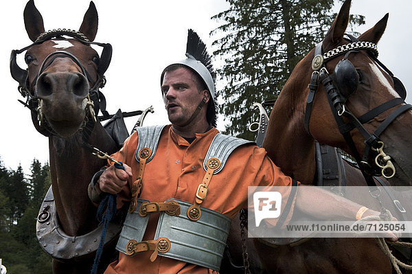 custom  traditions  customs  Franche montagne  charioteer  gladiator  Roman  horses  horse breed  Saignelégier  Switzerland  chariot race  chariot racing  marché-concours national de chevaux  horse market  orange  cold-blood horse  heavy horses  Jura mountains  nostrils  original Freiberg horse  Swiss horse breeding