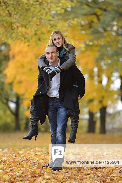 Happy couple in autumnal landscape