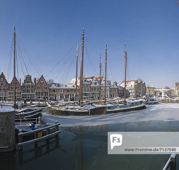 Netherlands  Holland  Europe  Hoorn  City  Village  Water  Winter  Snow  Ice  Ships  Boat  sailing ship  Old harbour