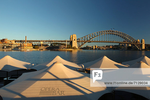 blauer Himmel wolkenloser Himmel wolkenlos Sehenswürdigkeit Wasser Hafen Morgen Sonnenaufgang Großstadt Architektur Brücke Bildschirm Schönheit Australien Metropole Sonne Sydney