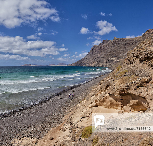 Spain  Lanzarote  Famara  Playa de Famara  landscape  water  summer  mountains  sea  people  Canary Islands