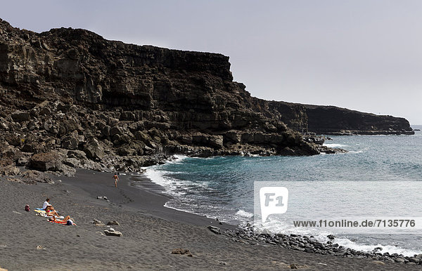Spain  Lanzarote  Las Casas de El Golfo  Black beach  Playa del Paso  landscape  water  summer  beach  sea  people  Canary Islands