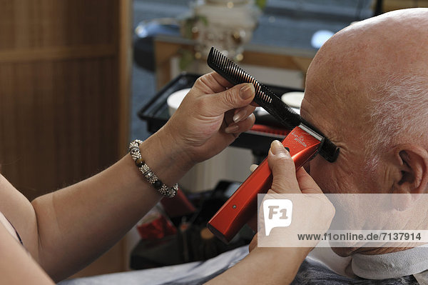 Elderly man at a hairdresser's  eyebrows cutting  Baden-Wuerttemberg  Germany  Europe