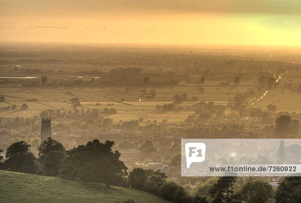 View of Glastonbury during sunset from Glastonbury Tor  Somerset  England  United Kingdom  Europe