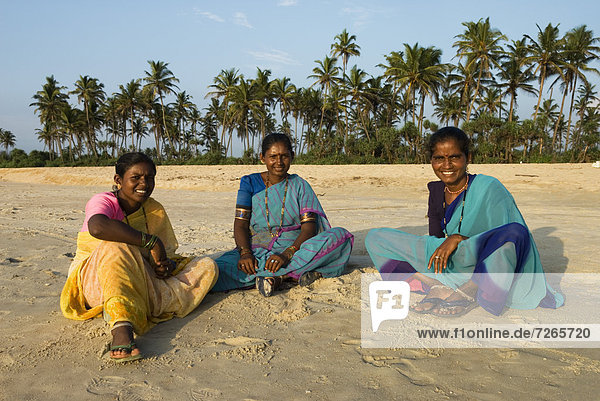 Local women on beach  Benaulim  Goa  India  Asia