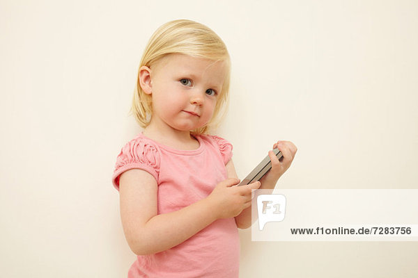 Toddler holding smartphone