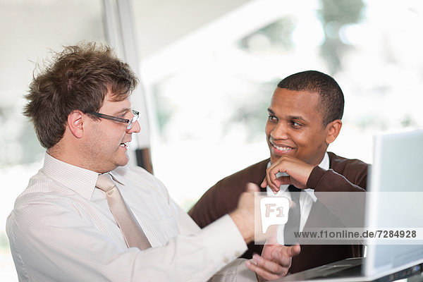 Businessmen talking in meeting